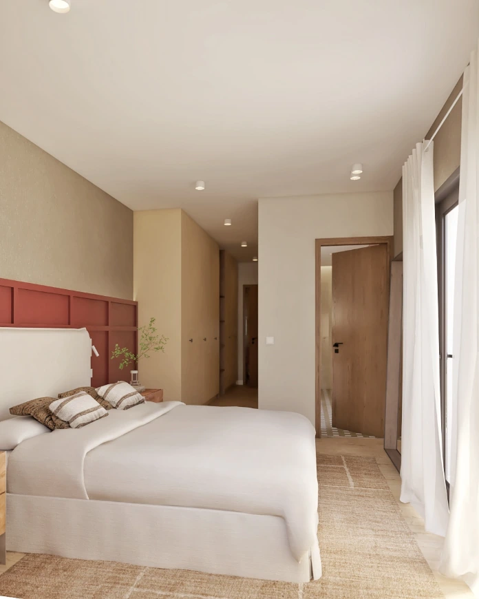 Dormitorio principal con cabecero en tono terracota y diseño contemporáneo