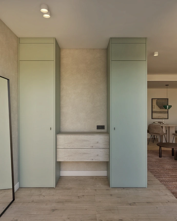 Zona de TV con mueble a medida y pared decorativa en vivienda reformada