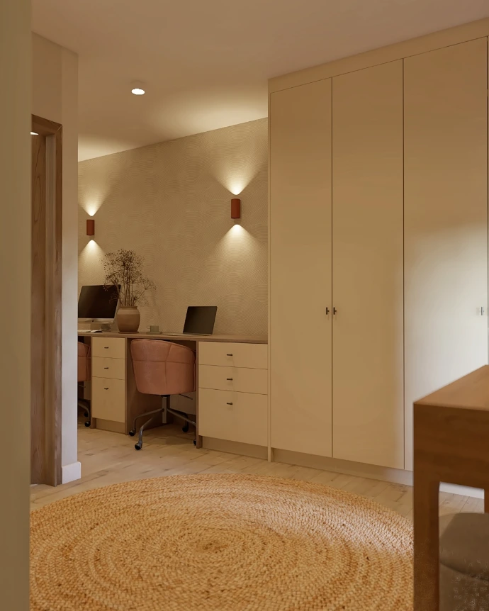 Pasillo con iluminación integrada y acabados cálidos en proyecto de interiorismo