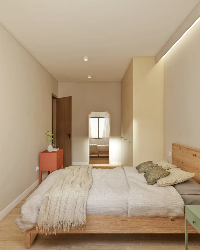 Dormitorio con luz natural y textiles cálidos en reforma integral de vivienda